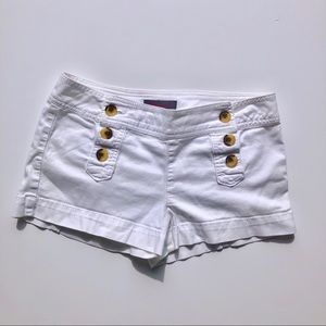 White shorts with buttons